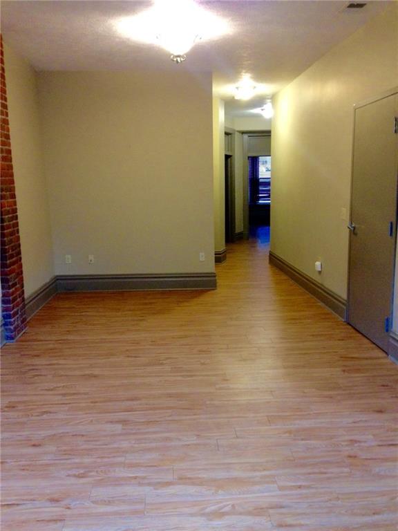 115 West Jefferson Street Butler, PA 16001 - Photo 30 of 30 a view of an empty room with wooden floor and closet