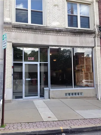 a view of a building with a glass door