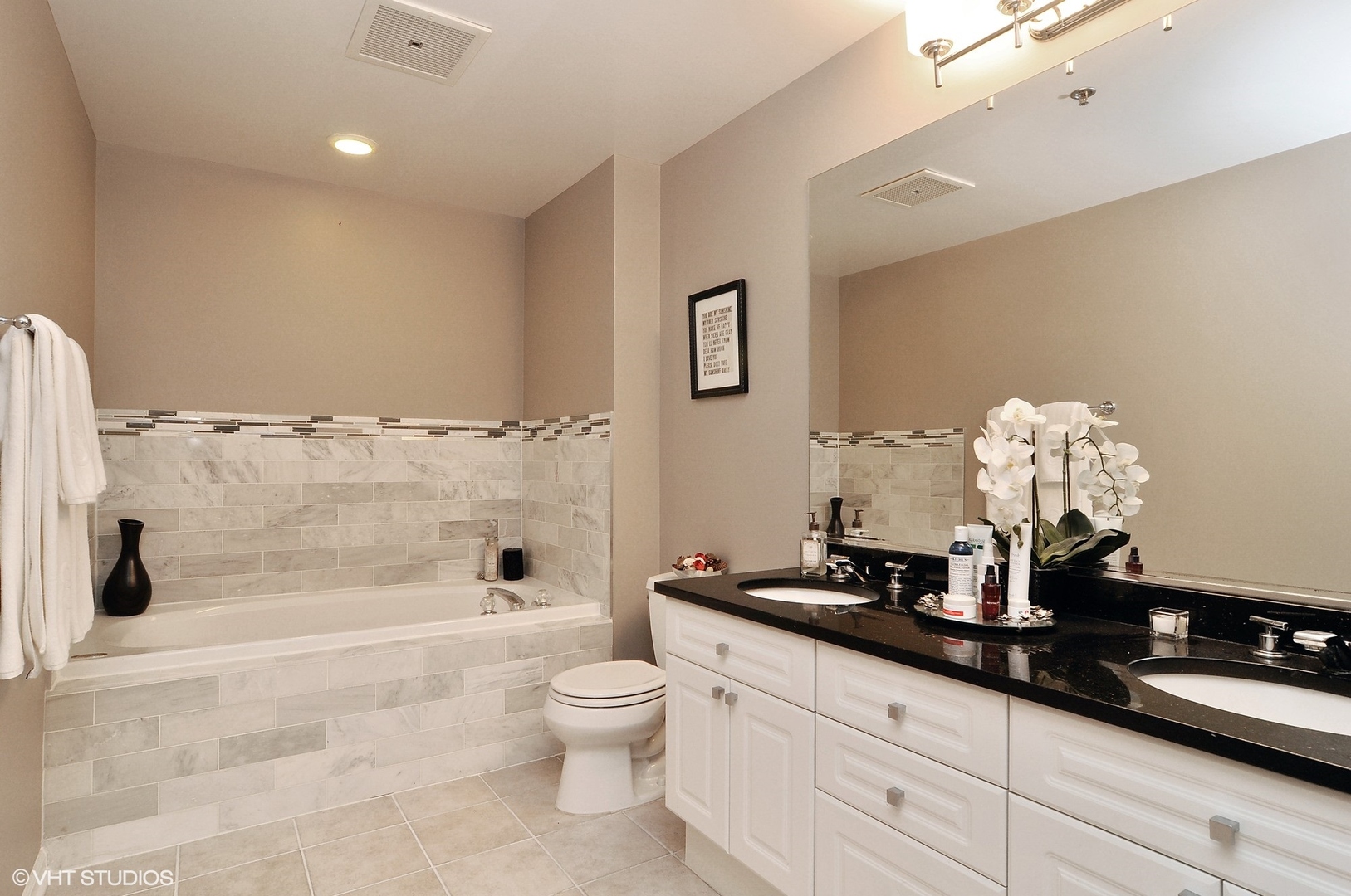 1122 North Dearborn Street, Unit 7A Chicago, IL 60610 - Photo 12 of 25 a bathroom with a sink a toilet and shower