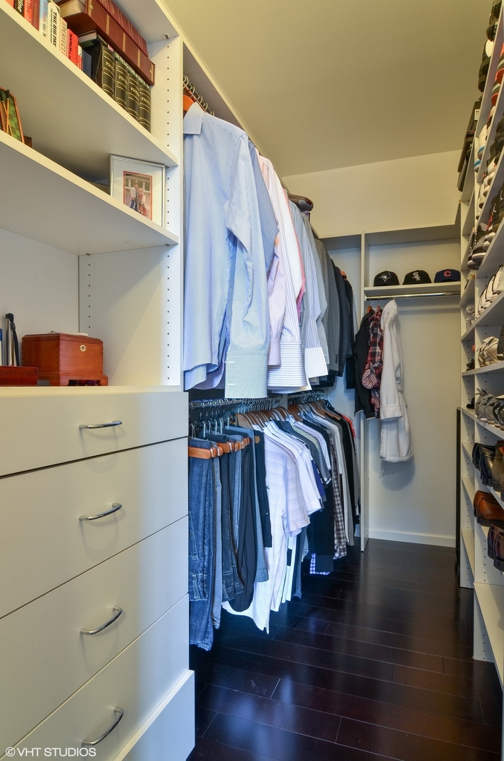 1122 North Dearborn Street, Unit 7A Chicago, IL 60610 - Photo 13 of 25 a view of walk in closet with clothes and shoes