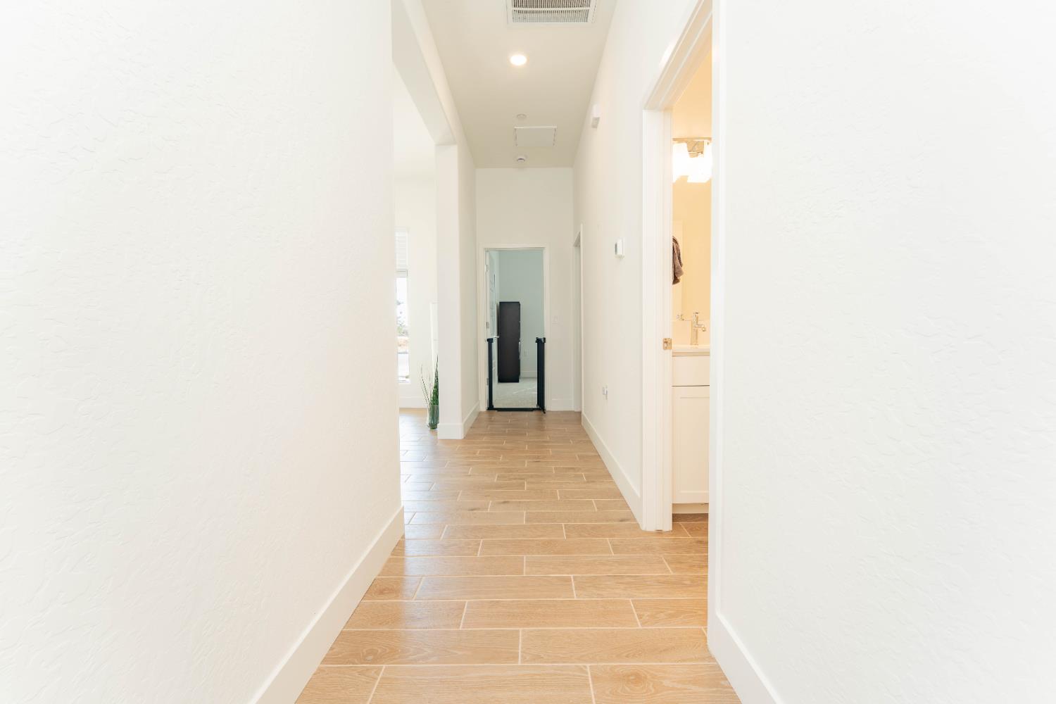3811 North Santa Fe Street Visalia, CA 93291 - Photo 14 of 23 a view of a hallway with a white walls