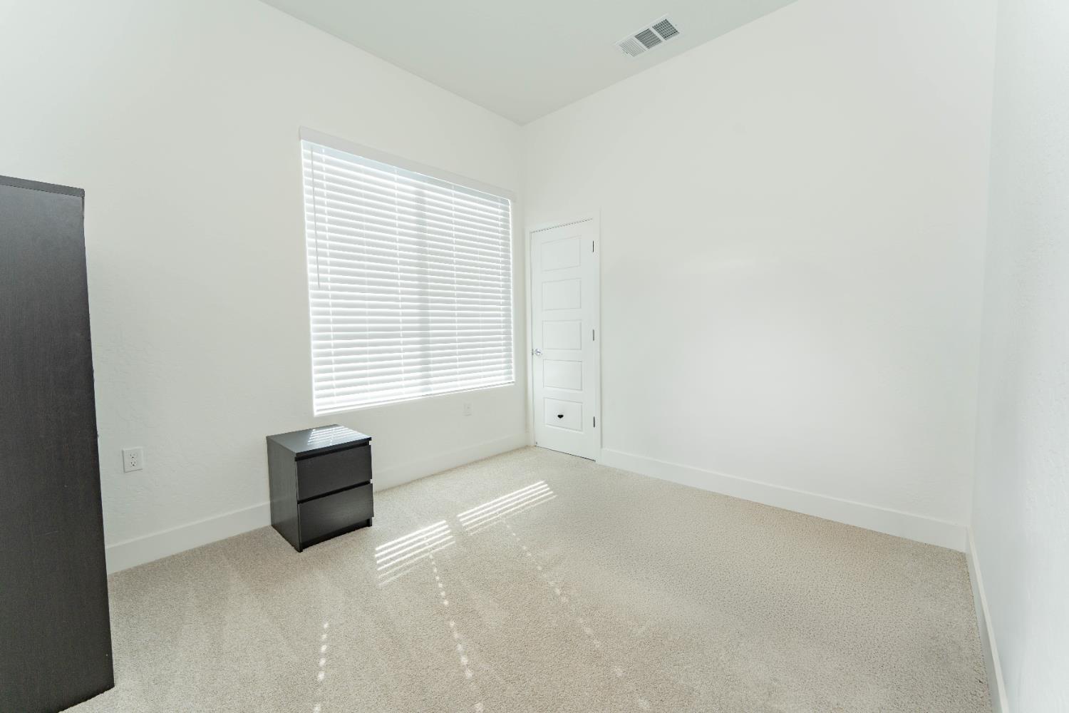 3811 North Santa Fe Street Visalia, CA 93291 - Photo 18 of 23 an empty room with windows