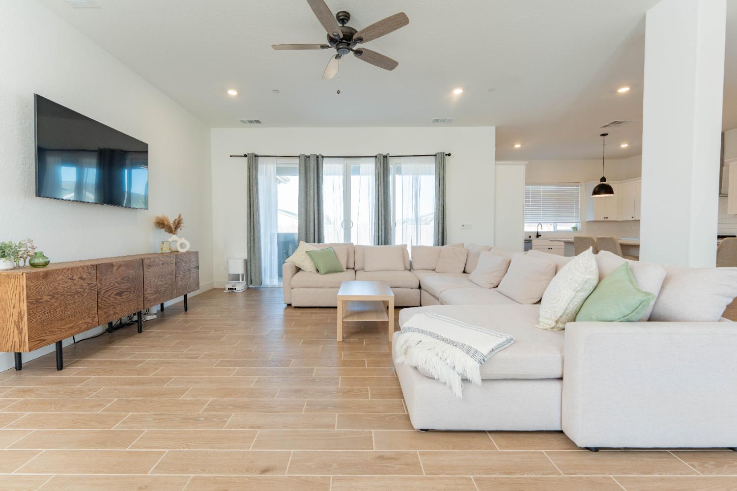 3811 North Santa Fe Street Visalia, CA 93291 - Photo 6 of 23 a living room with furniture and a large window