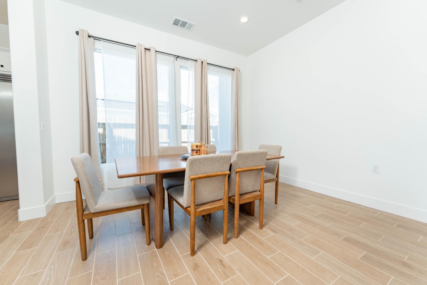 3811 North Santa Fe Street Visalia, CA 93291 - Photo 8 of 23 a dining room with furniture and wooden floor