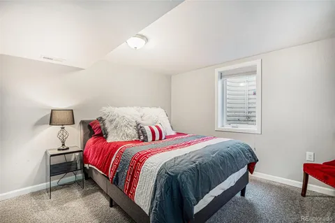 a bedroom with a bed and a closet