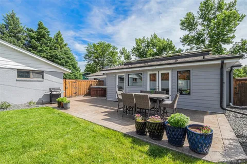a view of a house with backyard porch and sitting area