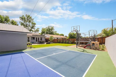 a view of a patio with table and chairs and potted plants
