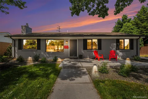 a view of a room with window and a potted plant