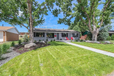 a view of a house with backyard porch and sitting area