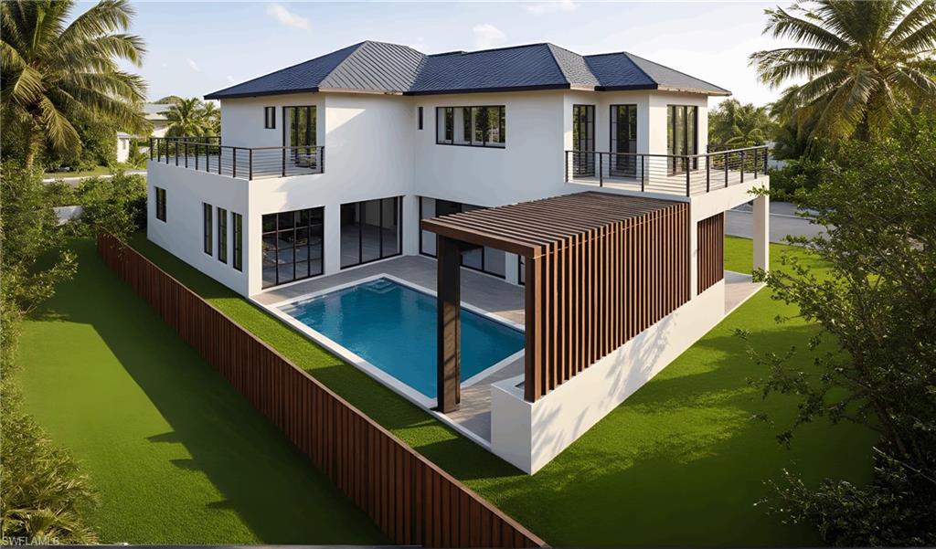 1165 8th Terrace North Naples, FL 34102 - Photo 11 of 11 a view of a house with pool and wooden fence