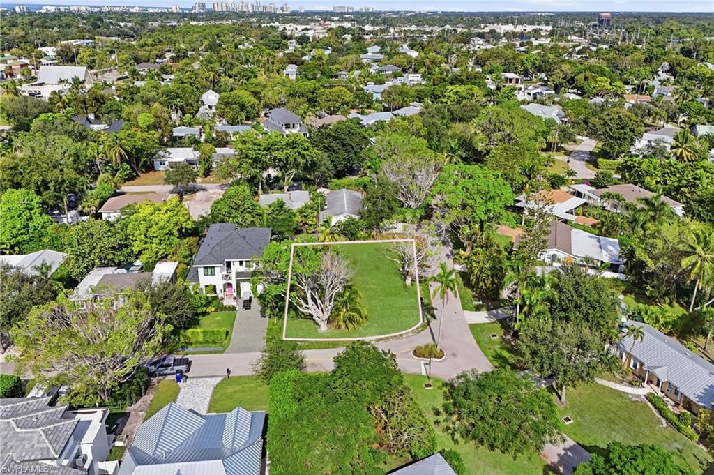1165 8th Terrace North Naples, FL 34102 - Photo 4 of 11 an aerial view of residential houses with outdoor space and trees