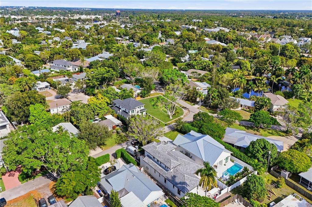1165 8th Terrace North Naples, FL 34102 - Photo 5 of 11 an aerial view of residential houses with outdoor space and trees