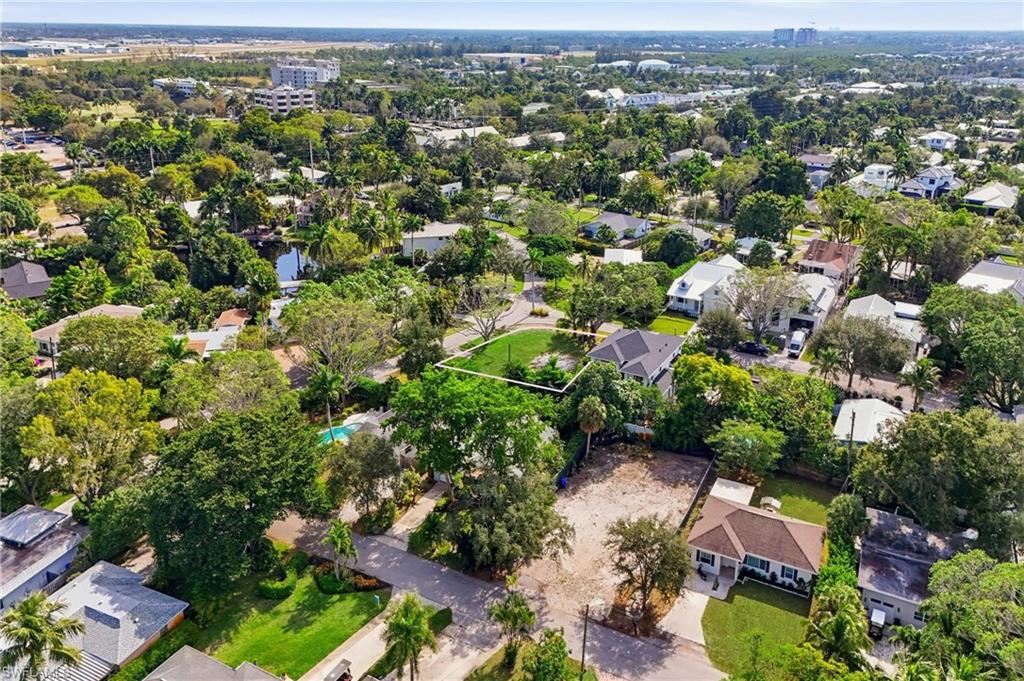 1165 8th Terrace North Naples, FL 34102 - Photo 7 of 11 an aerial view of a city with lots of residential buildings