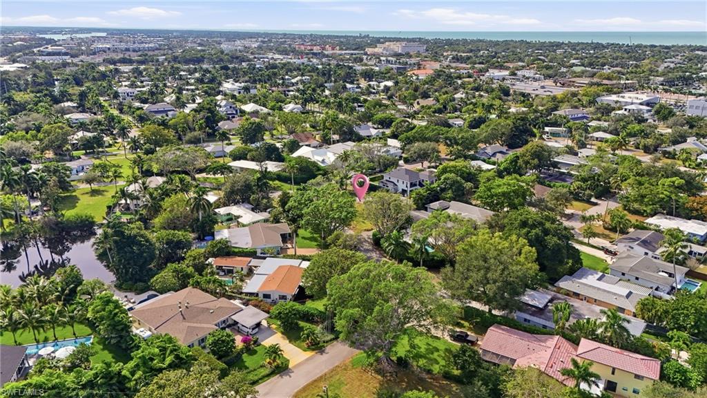 1165 8th Terrace North Naples, FL 34102 - Photo 9 of 11 an aerial view of a city with lots of residential buildings