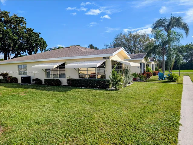 a view of swimming pool with a yard