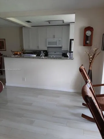 a view of workspace with wooden floor