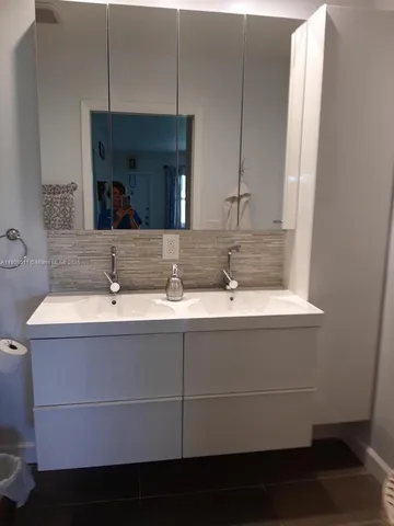a sink with a mirror