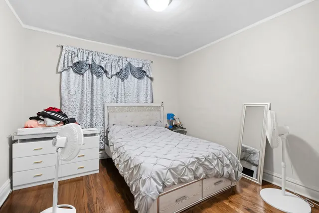 a bedroom with a bed and a dresser