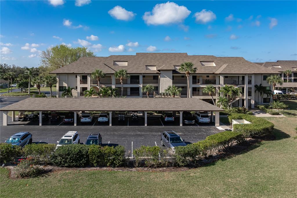 2 Pirates Lane, Unit 23B Punta Gorda, FL 33955 - Photo 1 of 70 a view of a big house with a big yard and potted plants