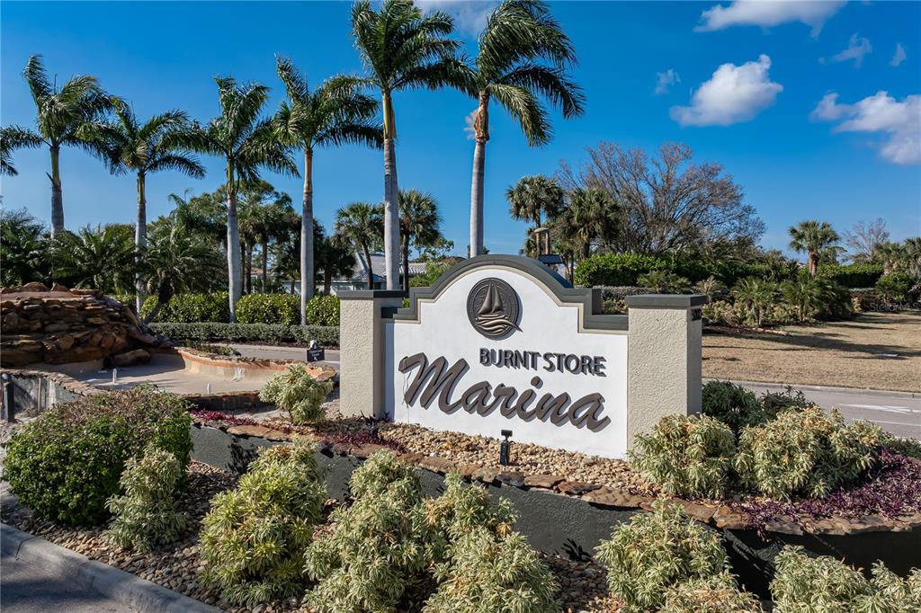 2 Pirates Lane, Unit 23B Punta Gorda, FL 33955 - Photo 13 of 70 a view of outdoor space with sign board and potted plants