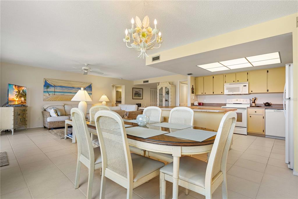 2 Pirates Lane, Unit 23B Punta Gorda, FL 33955 - Photo 28 of 70 a dining room with furniture and a chandelier