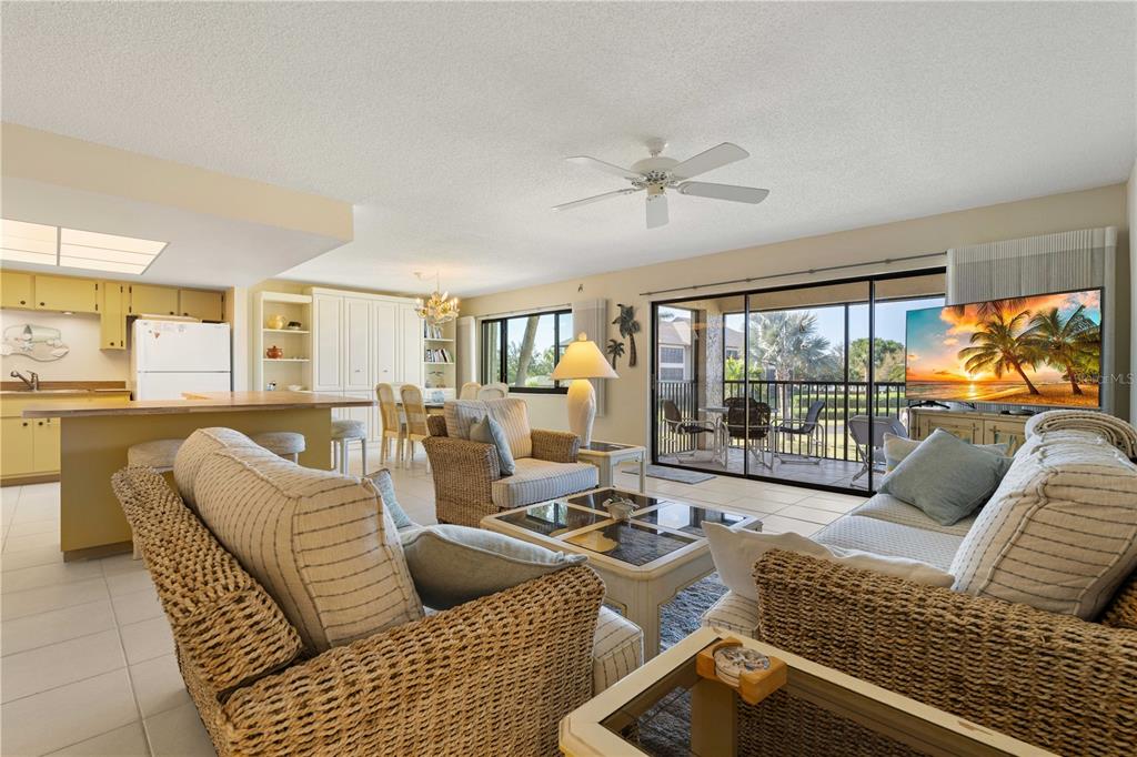 2 Pirates Lane, Unit 23B Punta Gorda, FL 33955 - Photo 3 of 70 a living room with furniture or outdoor view and a large window