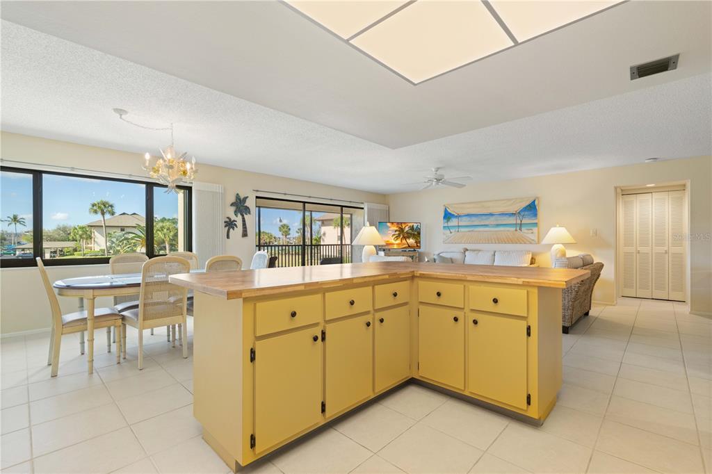 2 Pirates Lane, Unit 23B Punta Gorda, FL 33955 - Photo 36 of 70 a kitchen with cabinets and chairs