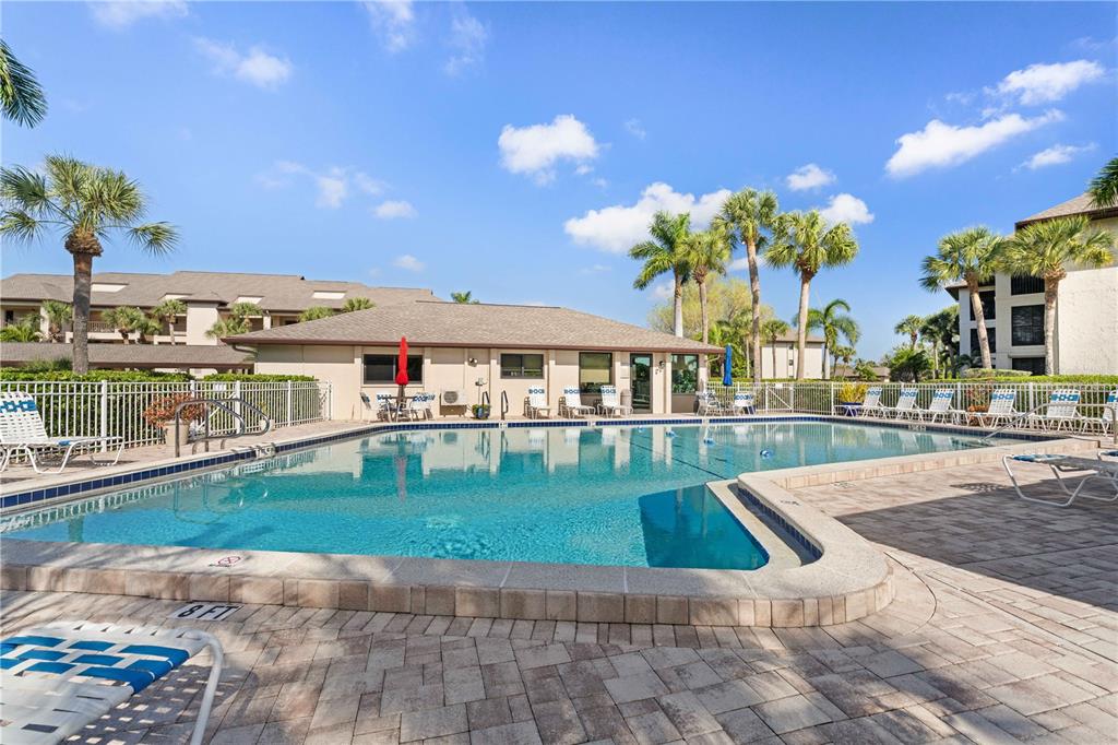 2 Pirates Lane, Unit 23B Punta Gorda, FL 33955 - Photo 4 of 70 a view of a swimming pool with a lounge chairs