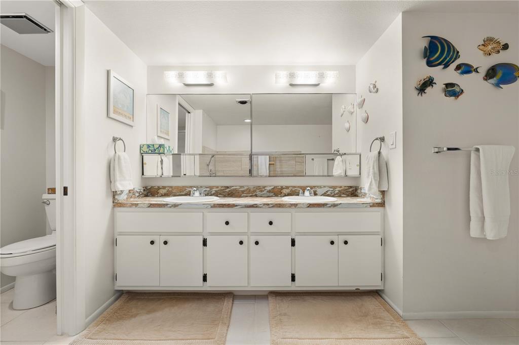 2 Pirates Lane, Unit 23B Punta Gorda, FL 33955 - Photo 44 of 70 a bathroom with a granite countertop sink and a mirror