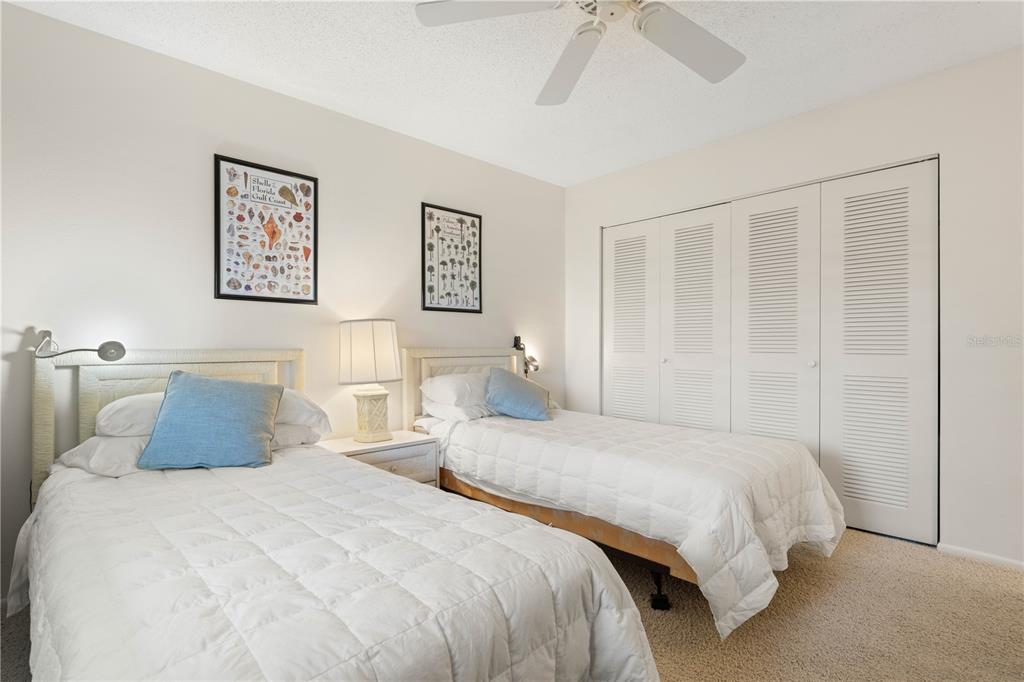 2 Pirates Lane, Unit 23B Punta Gorda, FL 33955 - Photo 49 of 70 a bedroom with two beds and a shower