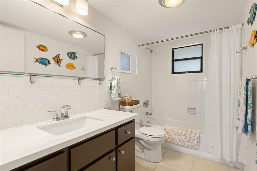 2 Pirates Lane, Unit 23B Punta Gorda, FL 33955 - Photo 50 of 70 a bathroom with a sink a toilet and shower