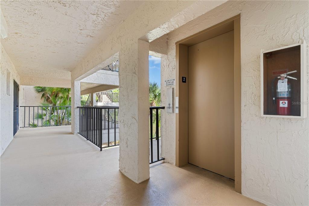 2 Pirates Lane, Unit 23B Punta Gorda, FL 33955 - Photo 52 of 70 a view of a hallway with wooden floor and a livingroom