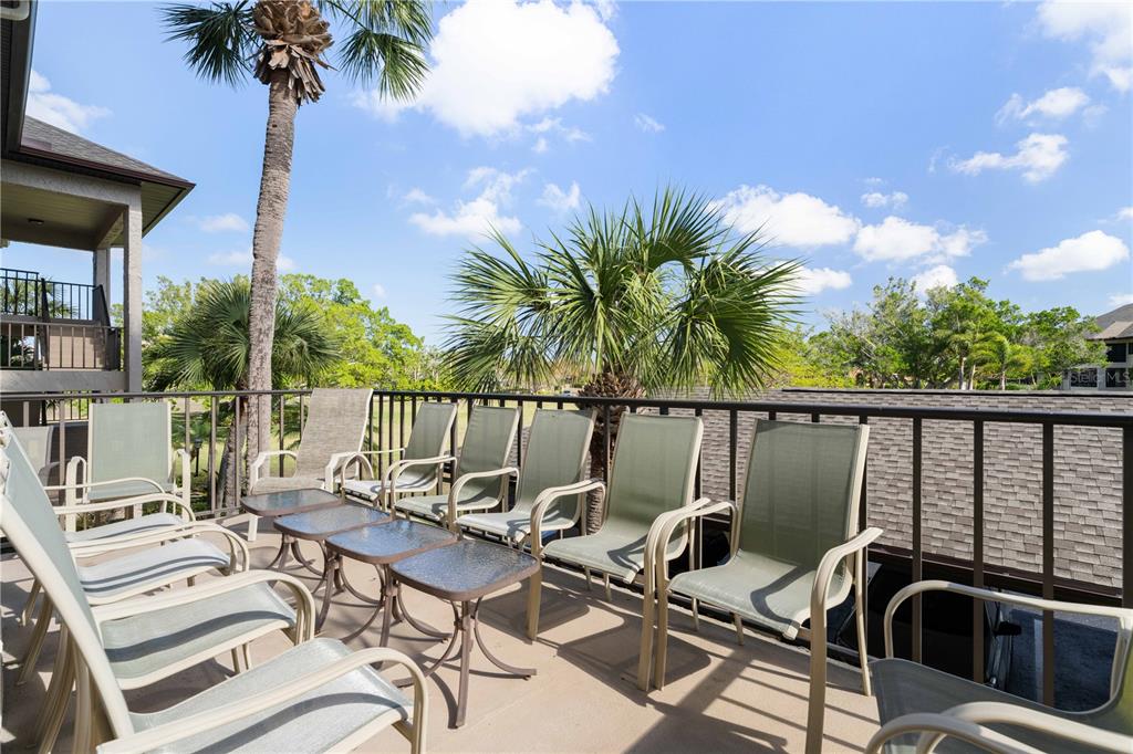2 Pirates Lane, Unit 23B Punta Gorda, FL 33955 - Photo 53 of 70 a view of a balcony with chairs and potted plants