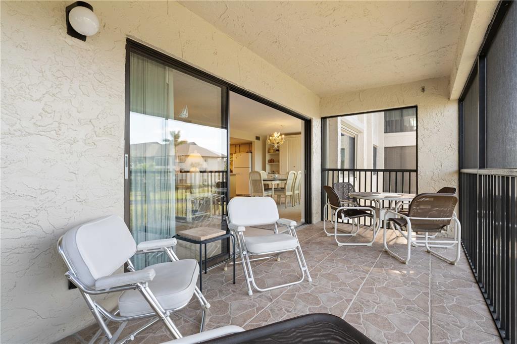 2 Pirates Lane, Unit 23B Punta Gorda, FL 33955 - Photo 10 of 70 a living room with furniture and a floor to ceiling window