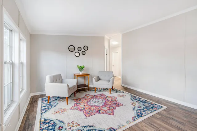 a view of white house with a snow on the road