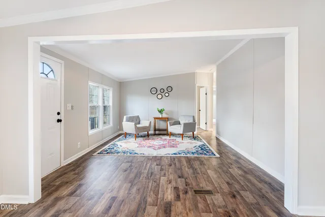 a living room with furniture and a rug