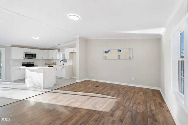 a view of a kitchen with microwave and cabinets