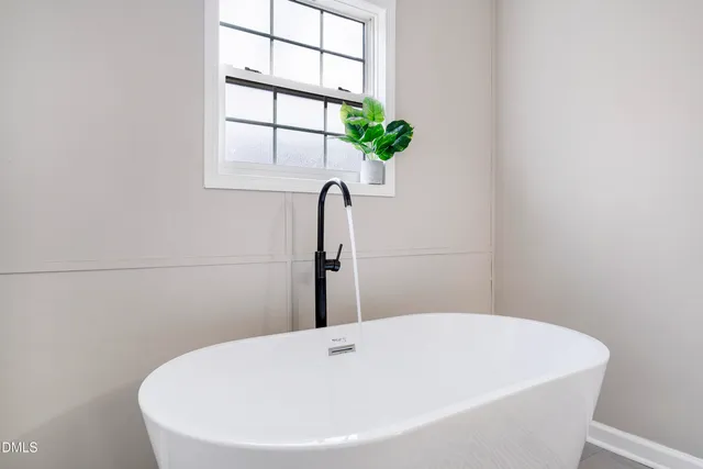 a view of an empty room with windows