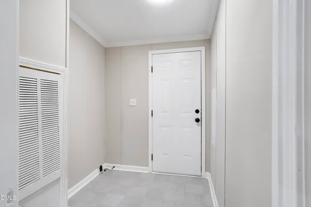 a view of a backyard with a large tree