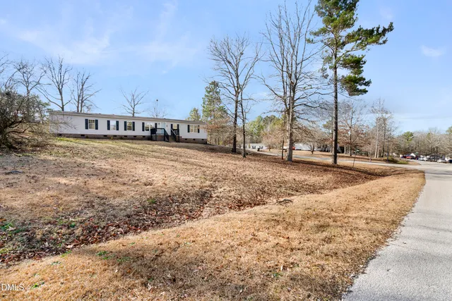 a view of a house with a fence