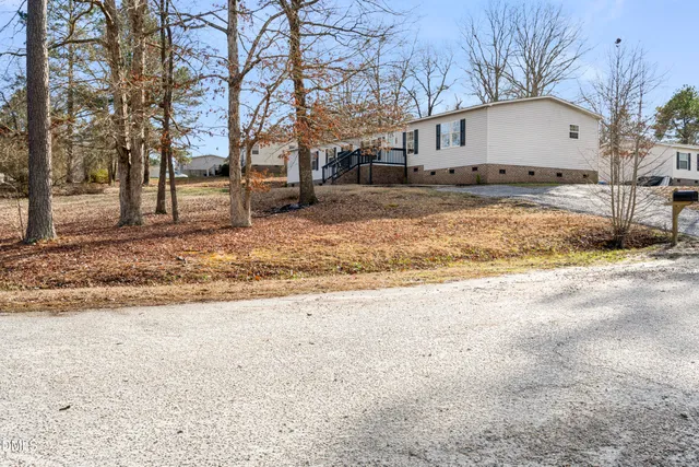 a view of a street with a building in the background