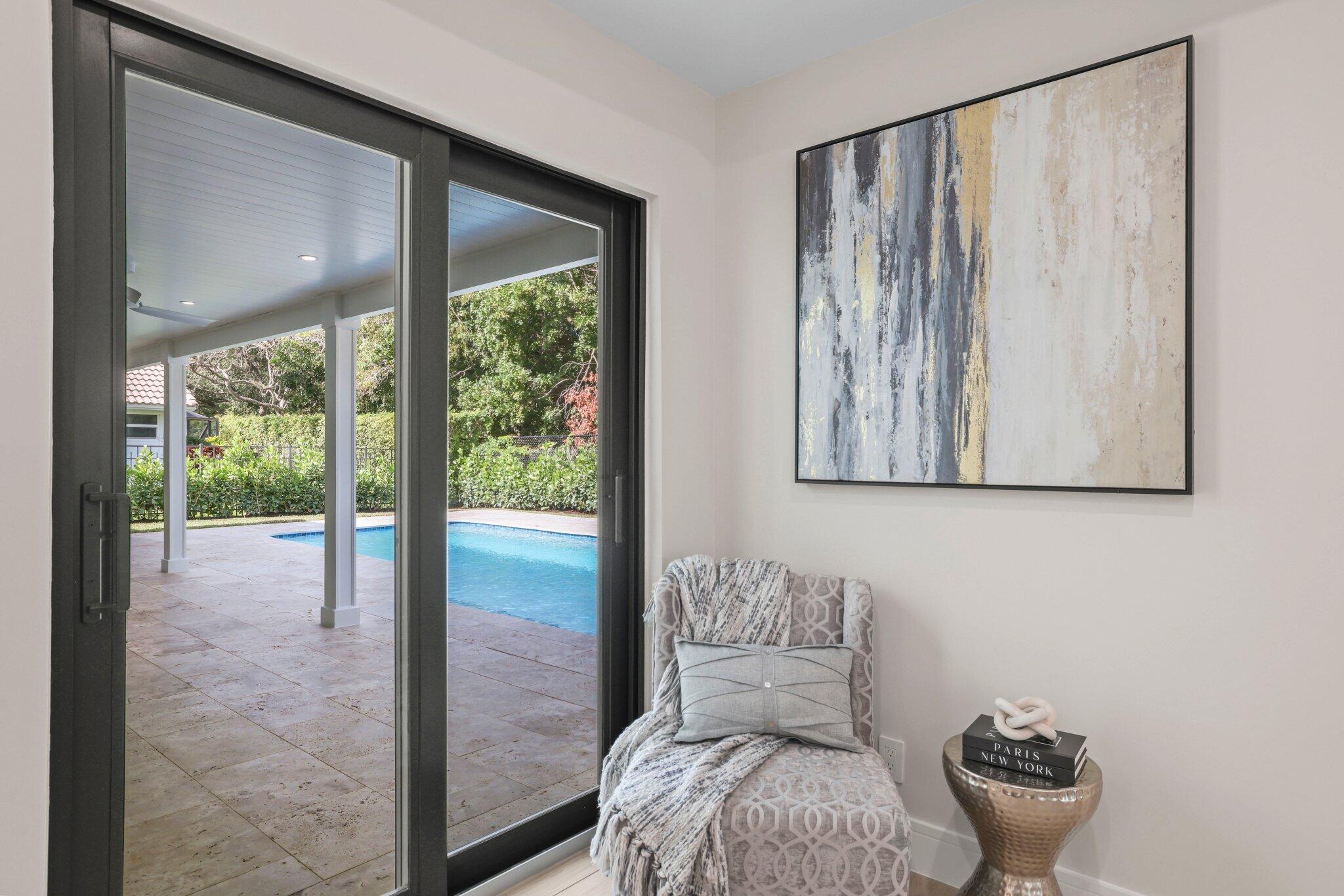 3901 Northwest 27th Avenue Boca Raton, FL 33434 - Photo 33 of 56 a living room with furniture and a potted plant