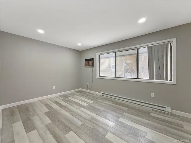 a view of empty room with windows