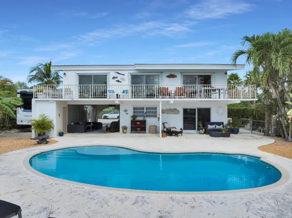 a view of house with outdoor space and seating space
