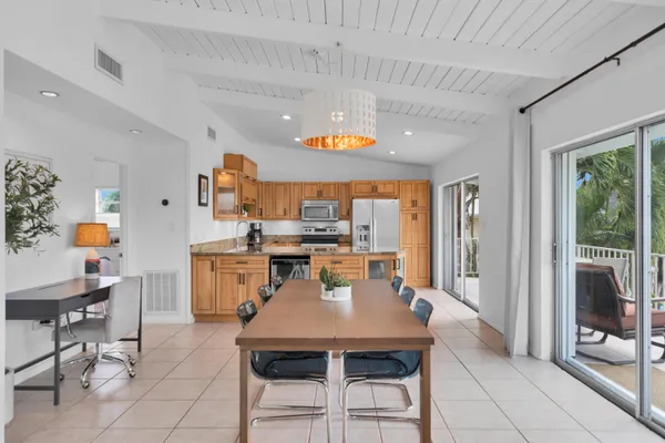 a view of kitchen and dining area with furniture