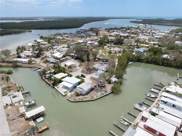 an aerial view of a houses with ocean view
