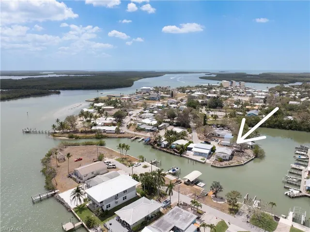an aerial view of a house with a lake view