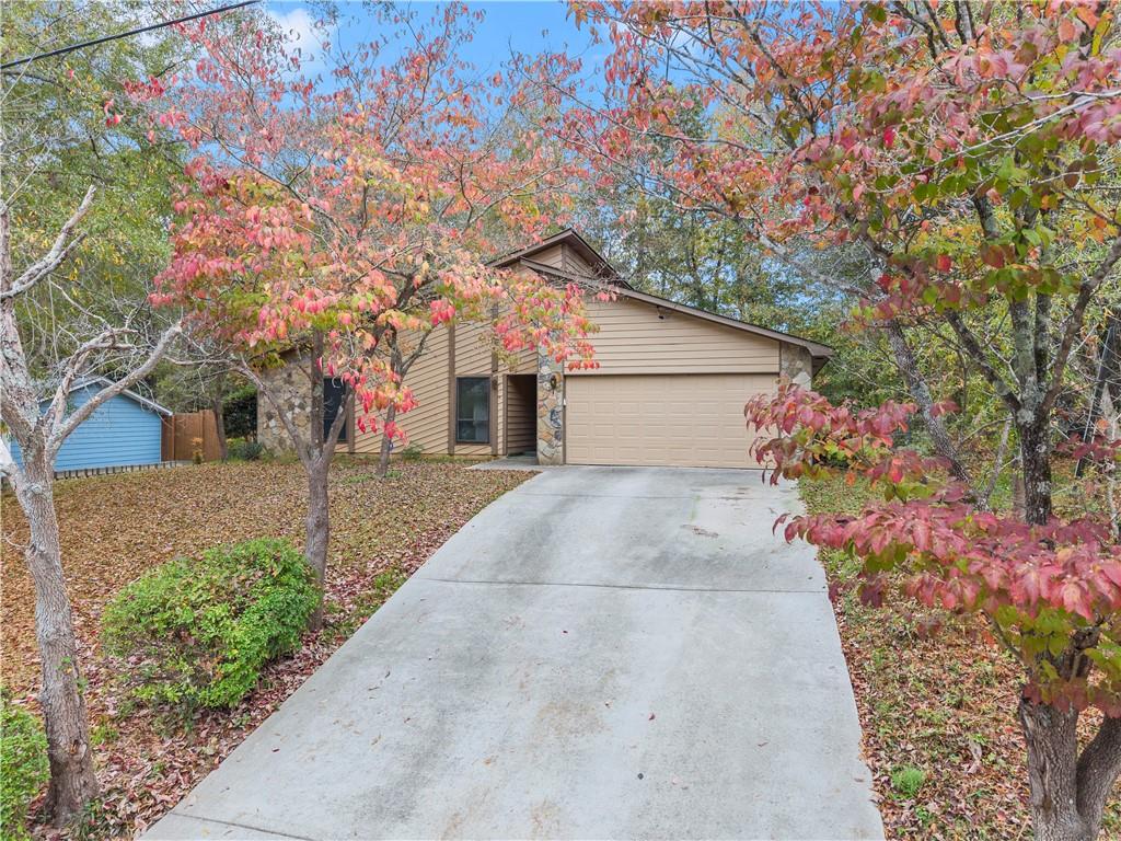7235 Connell Road Fairburn, GA 30213 - Photo 1 of 1 a backyard of a house with flower plants