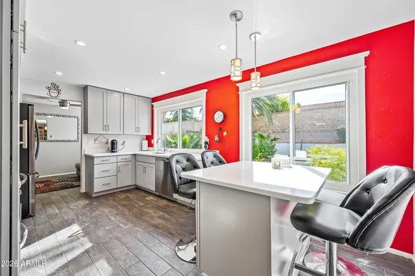 a room with furniture a flat screen tv and a floor to ceiling window