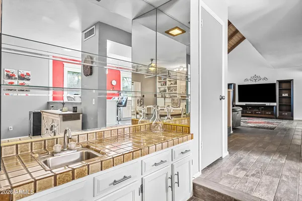 a view of hallway with wooden floor